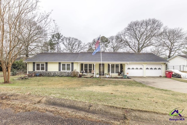 ranch-style home featuring a garage, a front yard, and a porch