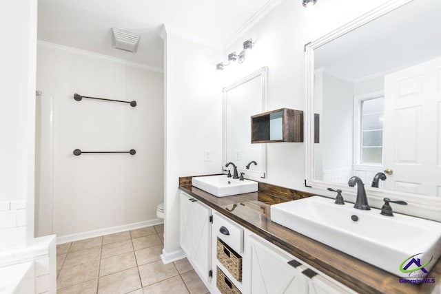 bathroom featuring crown molding, vanity, toilet, and tile patterned flooring