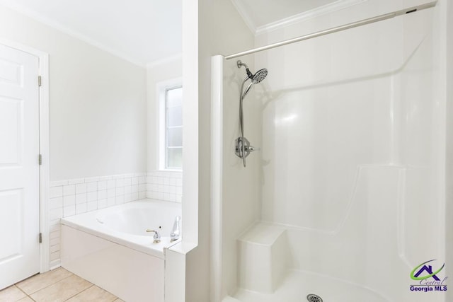 bathroom with tile patterned flooring, ornamental molding, and separate shower and tub