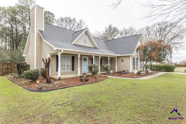 view of front of property with a porch and a front yard