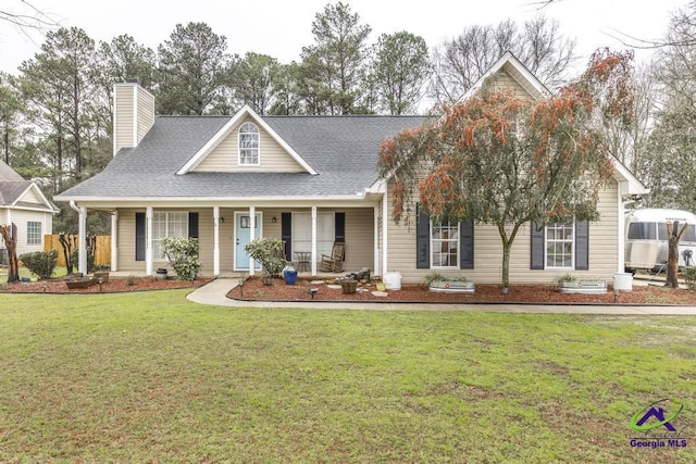 view of front facade featuring a front lawn and a porch