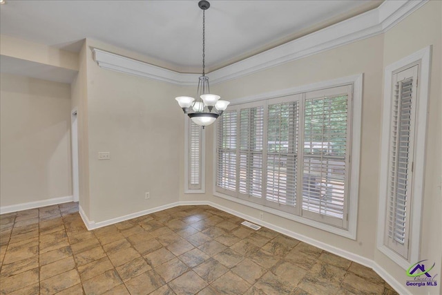 unfurnished dining area with an inviting chandelier and ornamental molding