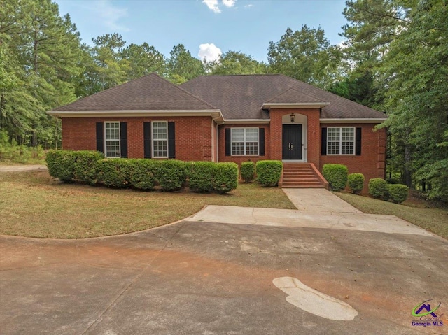 ranch-style house with a front lawn