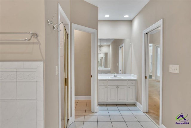 bathroom with tile patterned floors and vanity