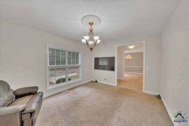 unfurnished living room featuring light colored carpet and a notable chandelier