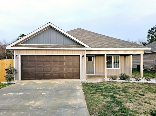 single story home featuring a garage and covered porch