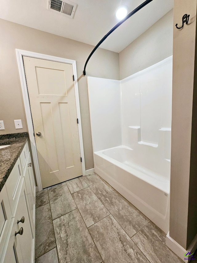 bathroom featuring vanity and shower / bath combination