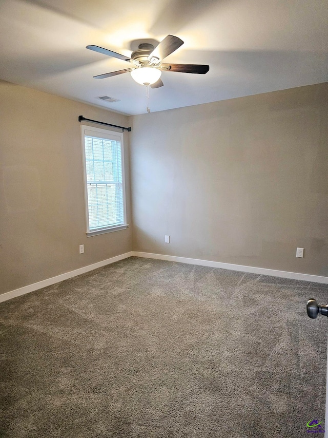 carpeted empty room featuring ceiling fan