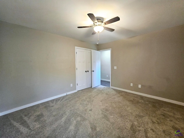spare room with carpet floors and ceiling fan