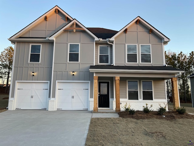 view of front of house with a garage and a porch