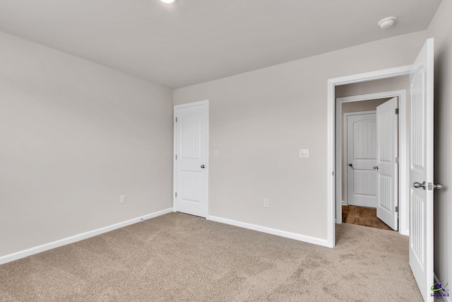 unfurnished bedroom with light carpet