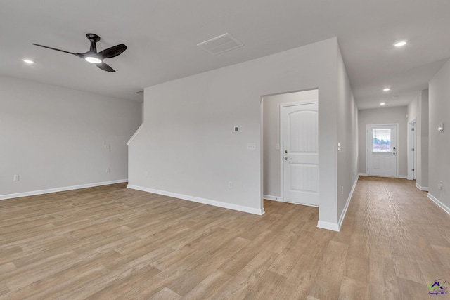 unfurnished living room featuring light hardwood / wood-style floors and ceiling fan