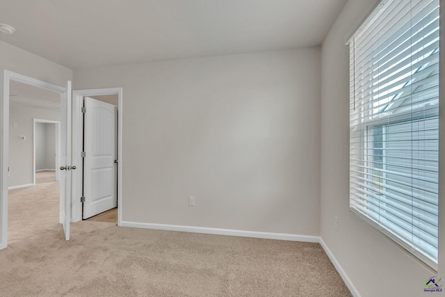 empty room featuring light colored carpet