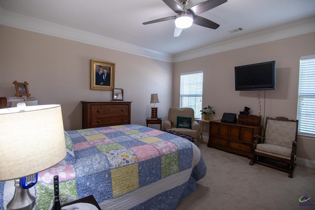 bedroom featuring ornamental molding, carpet floors, and ceiling fan