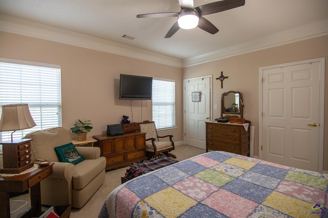 bedroom featuring ceiling fan, multiple windows, ornamental molding, and light carpet