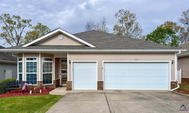 ranch-style home featuring a garage