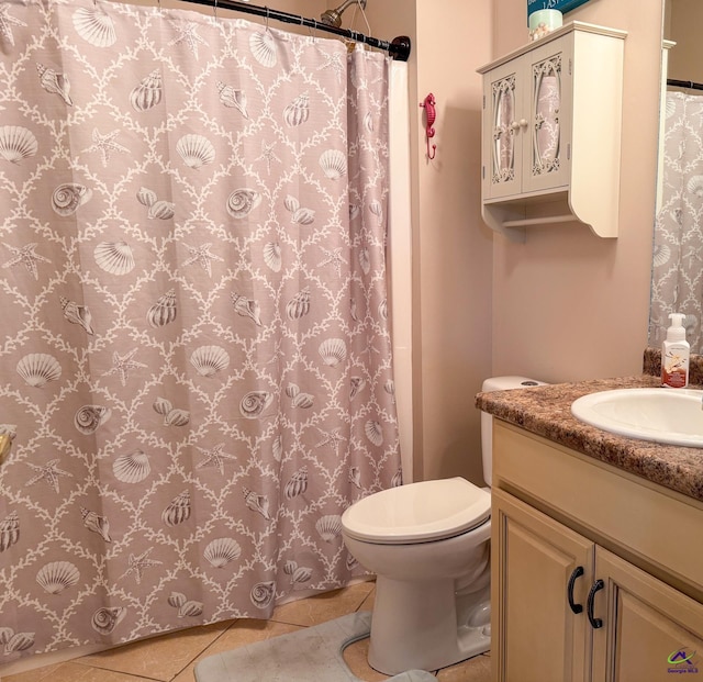 bathroom featuring walk in shower, tile patterned floors, toilet, and vanity