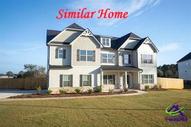 craftsman-style home with a front yard and a porch