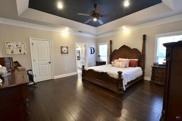 bedroom with dark wood-type flooring, ceiling fan, crown molding, and a raised ceiling