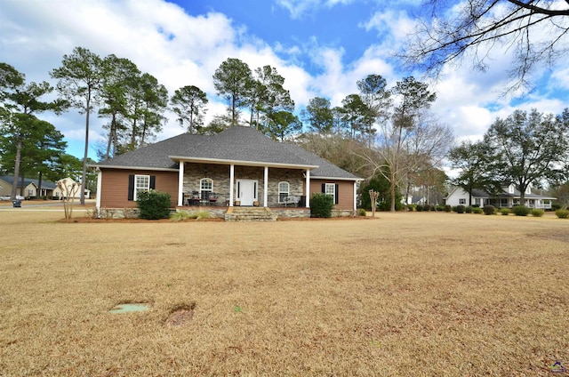 ranch-style home with a porch and a front lawn