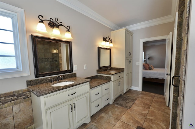 bathroom with crown molding, tile patterned floors, and vanity