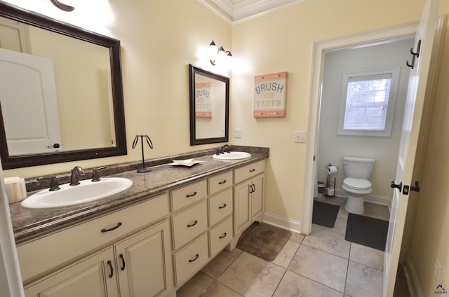 bathroom with vanity, tile patterned flooring, crown molding, and toilet