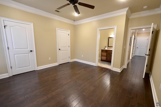 unfurnished bedroom with ceiling fan, ornamental molding, dark hardwood / wood-style floors, and ensuite bathroom