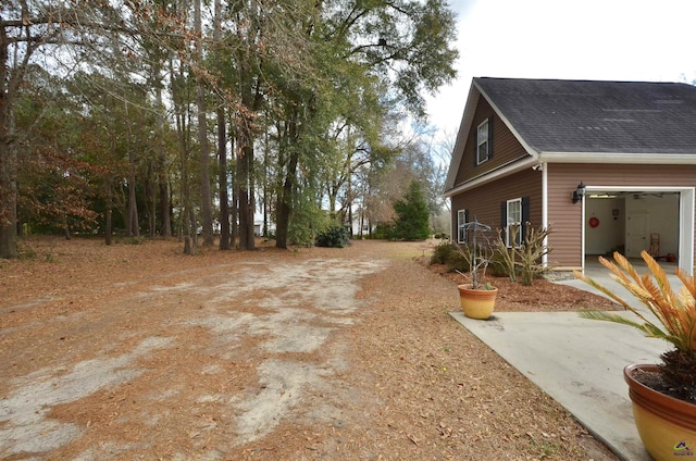 view of yard featuring a garage