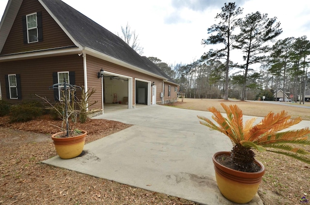 view of side of home featuring a garage