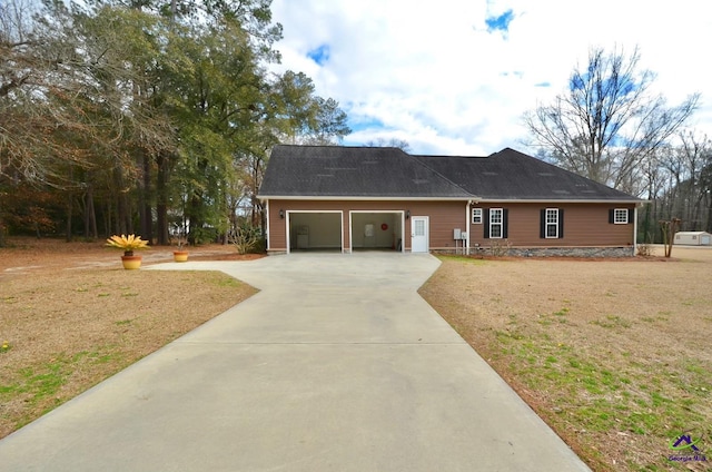 view of front of home with a garage and a front yard