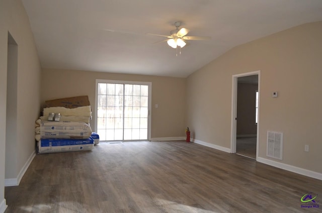 interior space featuring vaulted ceiling, dark hardwood / wood-style floors, and ceiling fan