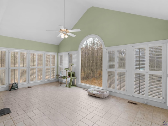 unfurnished sunroom featuring vaulted ceiling and ceiling fan