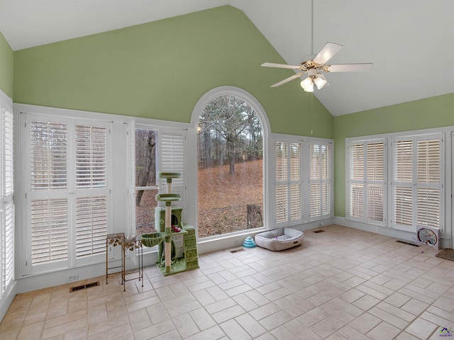 unfurnished sunroom with ceiling fan and lofted ceiling