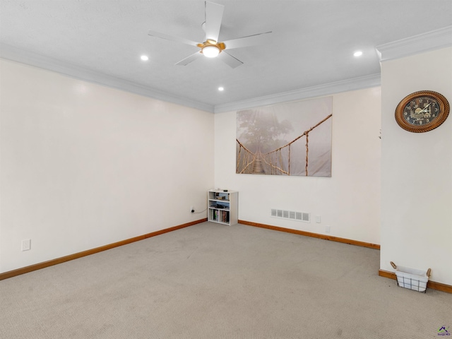 carpeted empty room with crown molding and ceiling fan