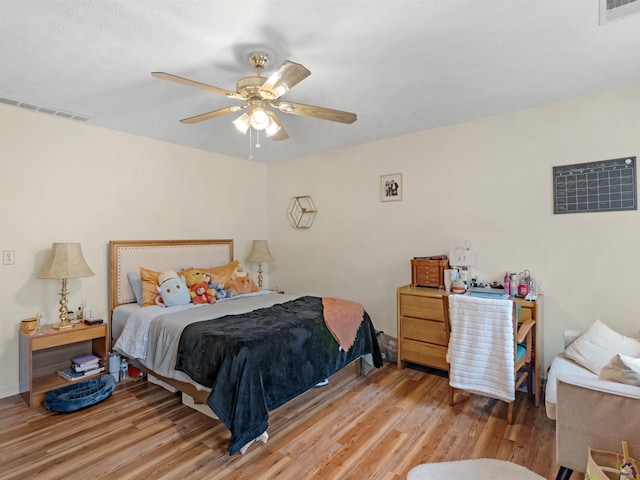 bedroom featuring light hardwood / wood-style flooring and ceiling fan