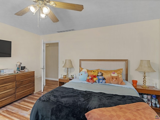 bedroom featuring hardwood / wood-style floors and ceiling fan