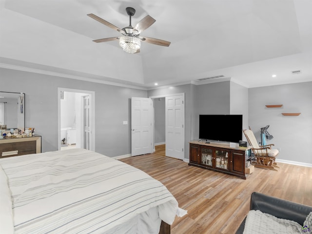 bedroom featuring ensuite bath, ornamental molding, light hardwood / wood-style floors, and ceiling fan