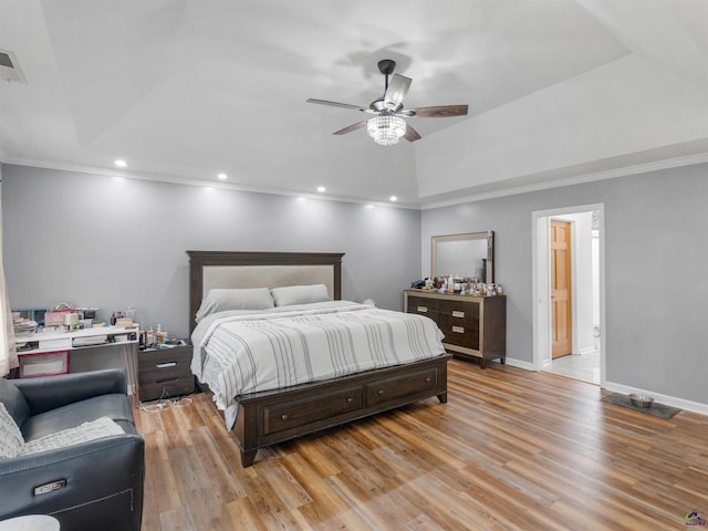 bedroom with light hardwood / wood-style flooring, ornamental molding, and ceiling fan