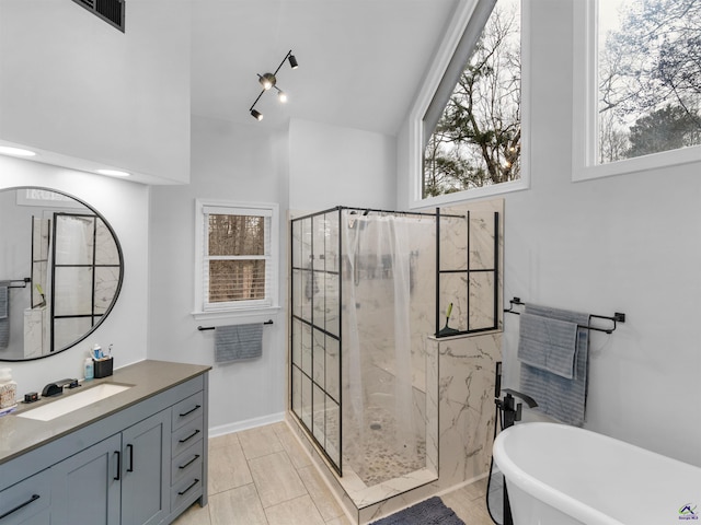 bathroom featuring independent shower and bath and vanity