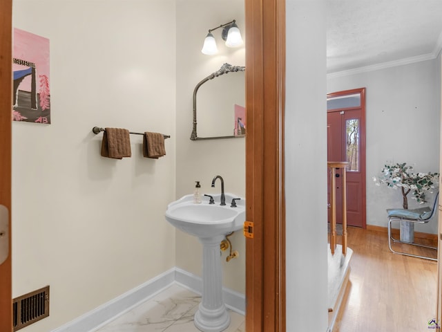 bathroom featuring ornamental molding