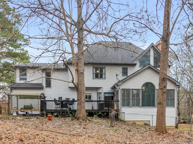 rear view of property with a deck