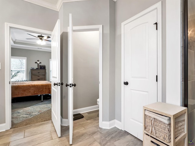 bathroom with ceiling fan, ornamental molding, and toilet