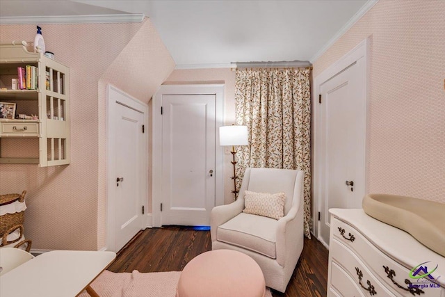 sitting room featuring ornamental molding and dark hardwood / wood-style floors