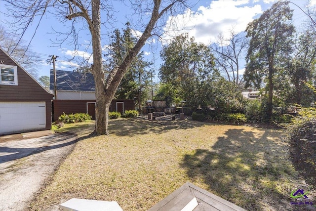 view of yard featuring a garage