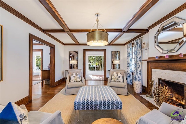 living area with coffered ceiling, dark hardwood / wood-style floors, a wealth of natural light, and a fireplace