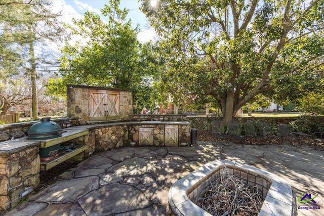 view of patio / terrace featuring a fire pit