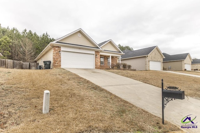 view of front of property featuring a garage and a front lawn