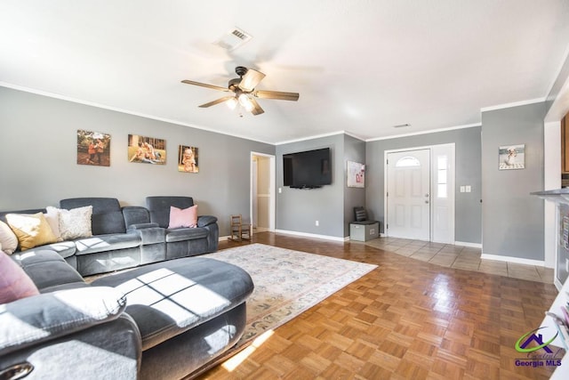 living room featuring parquet floors, ceiling fan, and crown molding