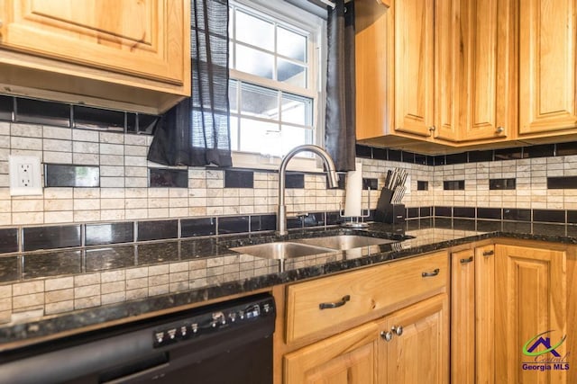 kitchen with sink, decorative backsplash, dark stone counters, and dishwasher