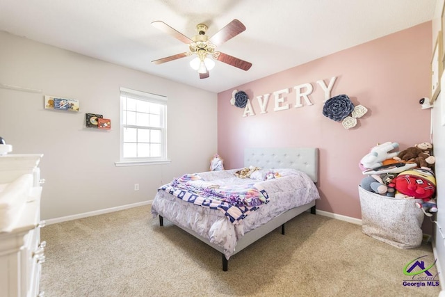 bedroom featuring light colored carpet and ceiling fan